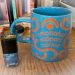 Coffee cup and nail polish bottle