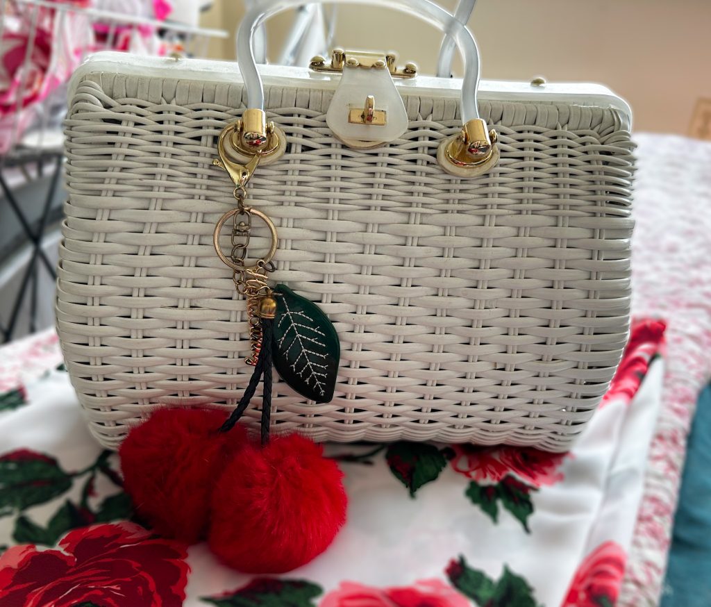 White wicker look purse with cherry charm