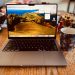 MacBook on table with coffee mug
